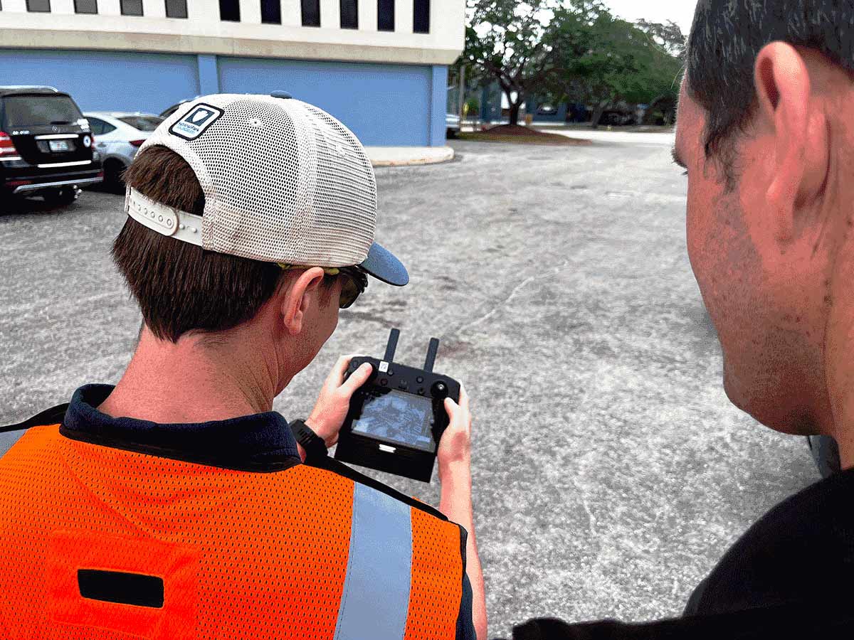 Drone Pilot Inspecting Office Building with Client for SB-4D inspections in Florida