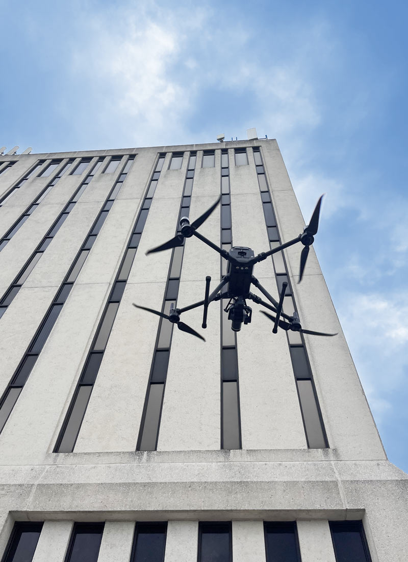 Drone Inspecting Building